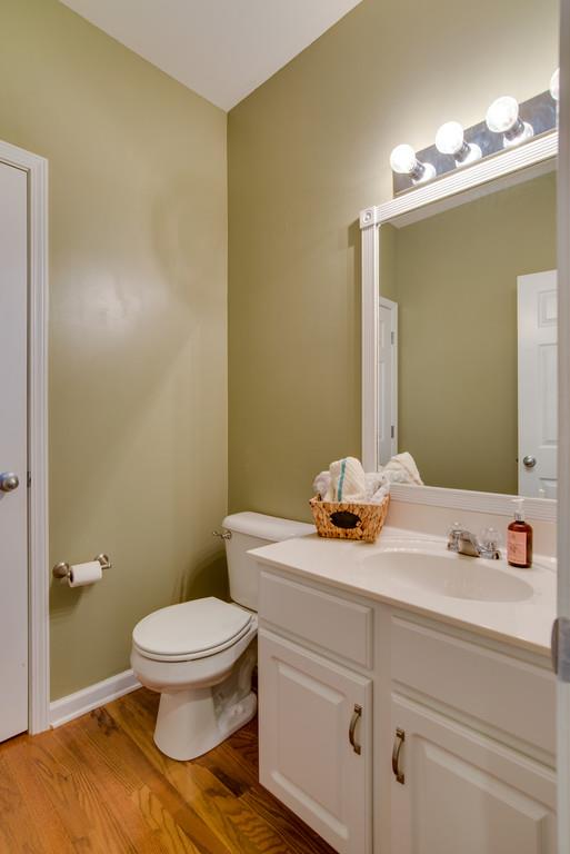 4029 Williford Way Spring Hill, TN 37174 - Photo 9 of 22 a bathroom with a sink a toilet a mirror and vanity