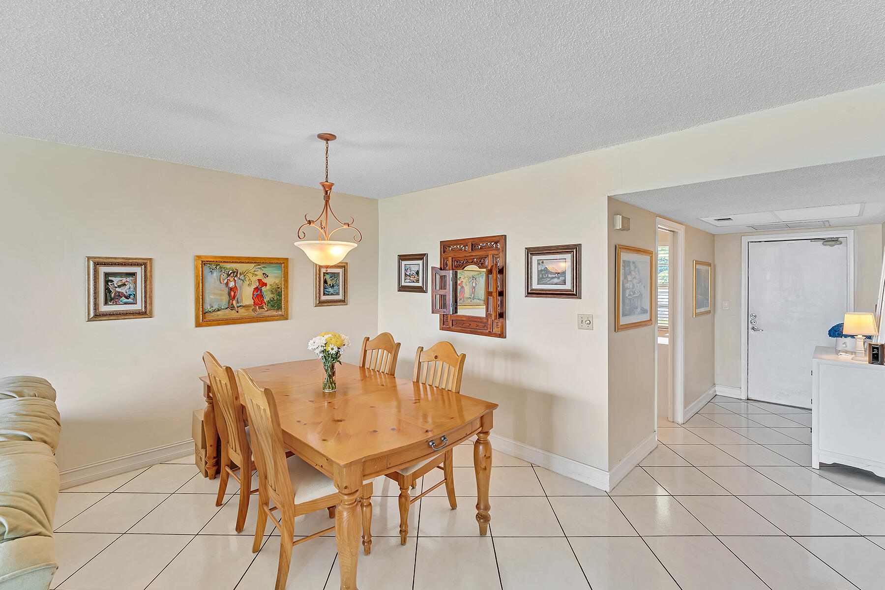 3091 North Course Drive, Unit 108 Pompano Beach, FL 33069 - Photo 11 of 42 a dining room with furniture and window