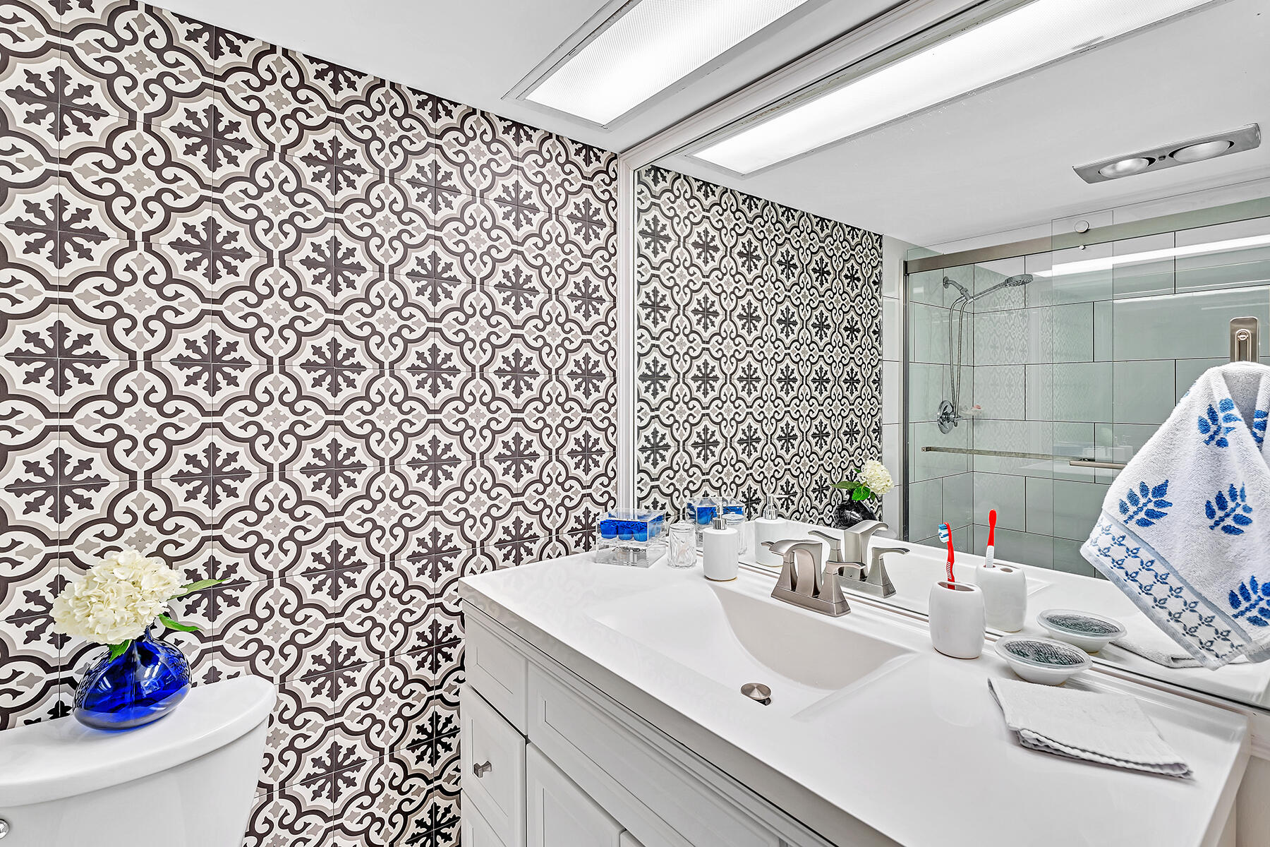 3091 North Course Drive, Unit 108 Pompano Beach, FL 33069 - Photo 18 of 42 a bathroom with a sink and a toilet