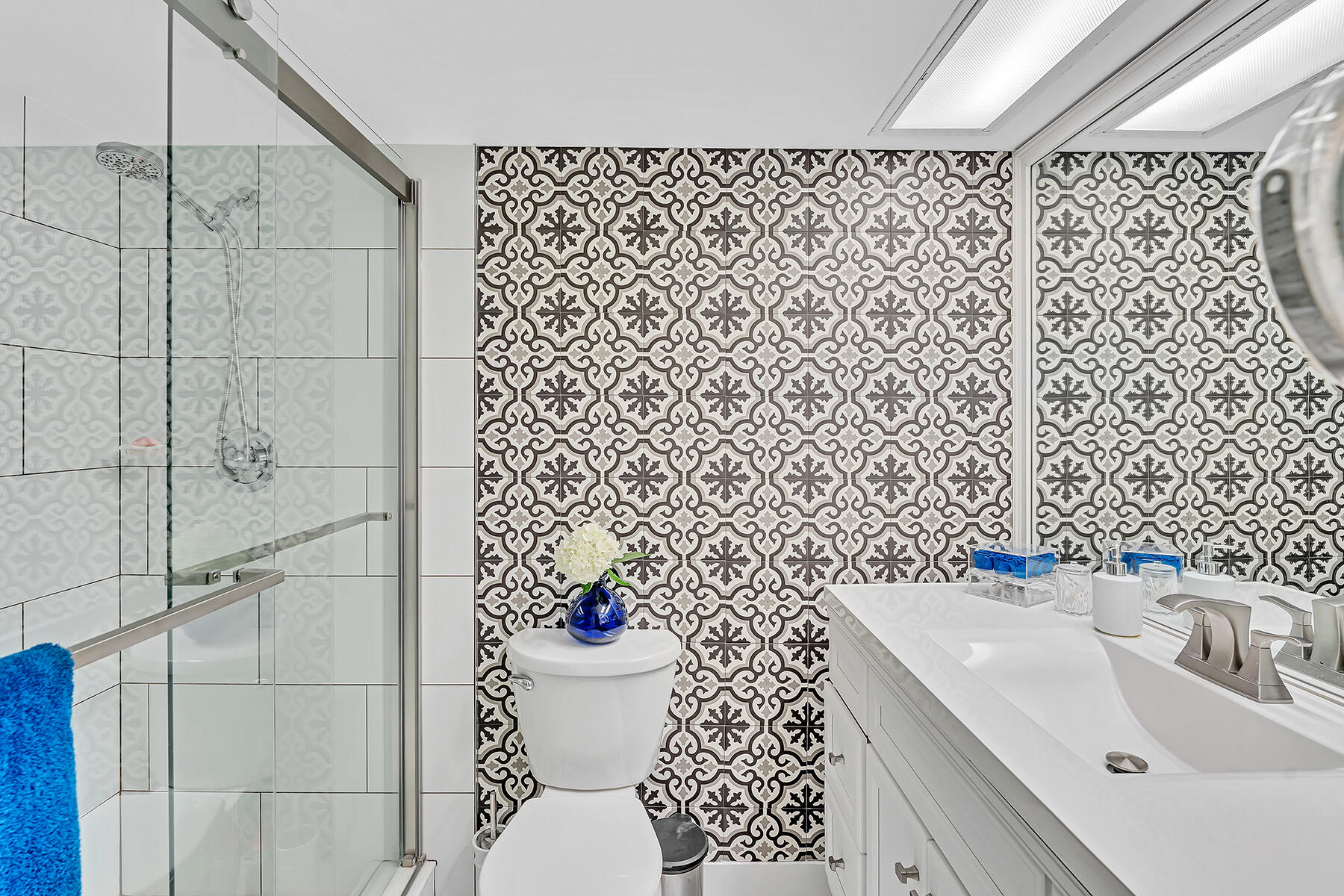 3091 North Course Drive, Unit 108 Pompano Beach, FL 33069 - Photo 19 of 42 a bathroom with a sink toilet and shower