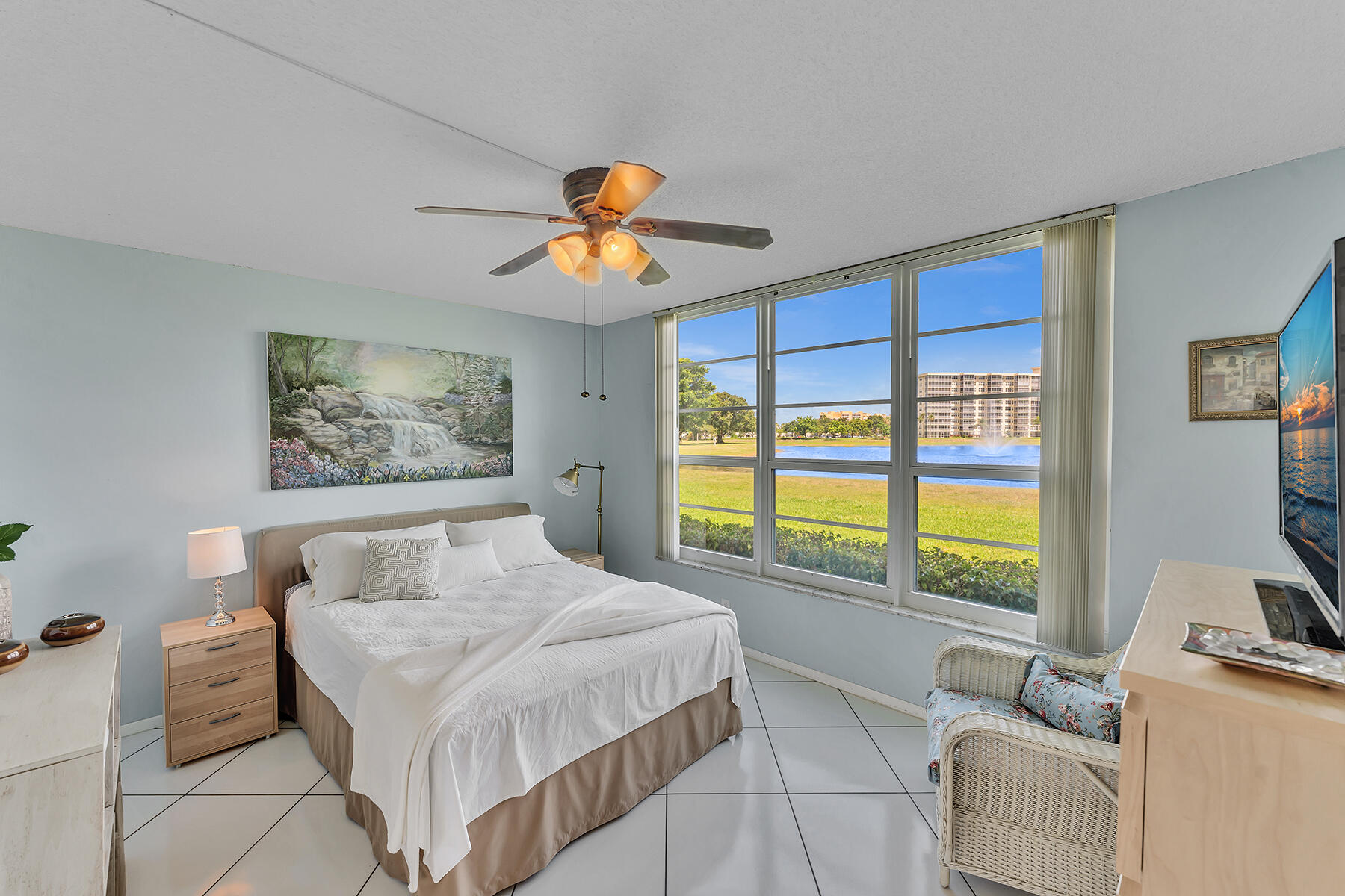 3091 North Course Drive, Unit 108 Pompano Beach, FL 33069 - Photo 24 of 42 a bedroom with a large bed and a window