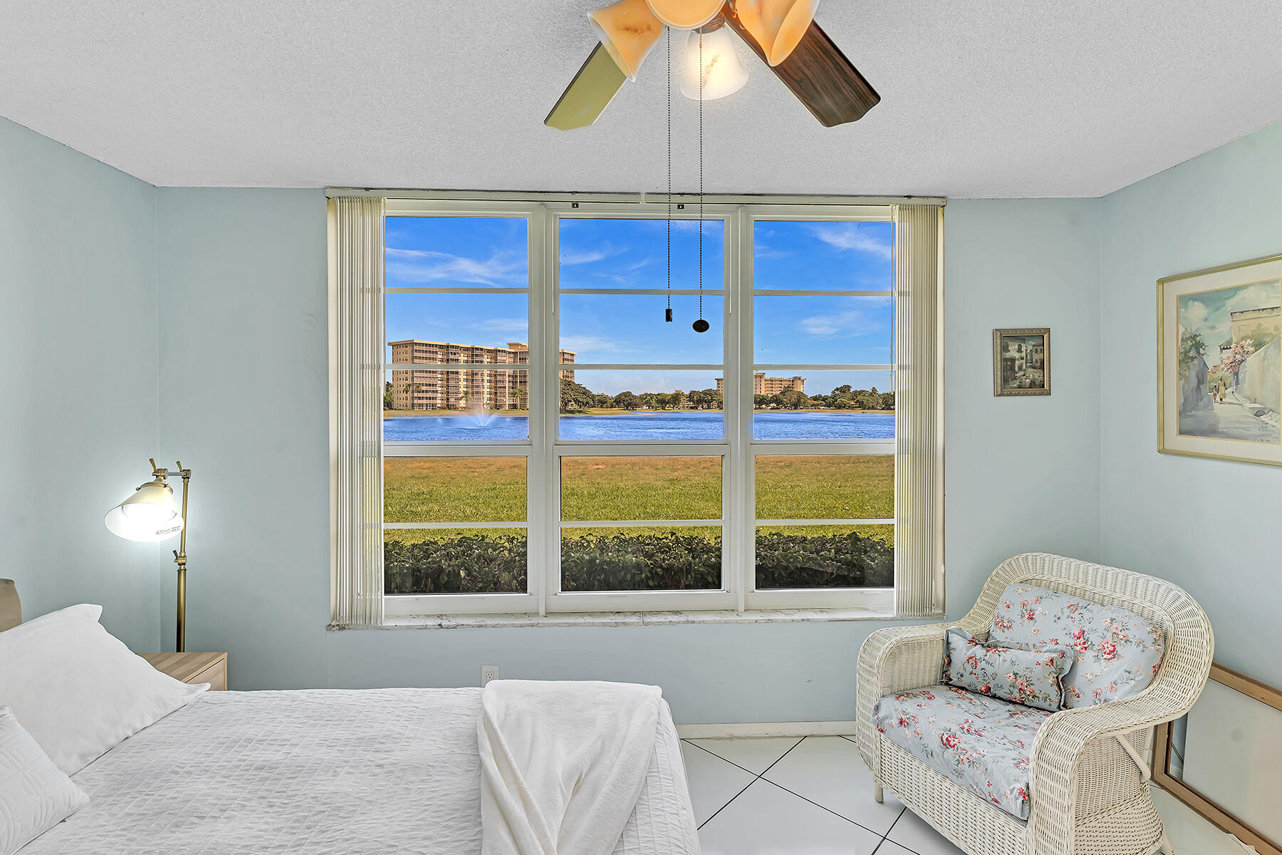 3091 North Course Drive, Unit 108 Pompano Beach, FL 33069 - Photo 25 of 42 a bedroom with a bed and a window