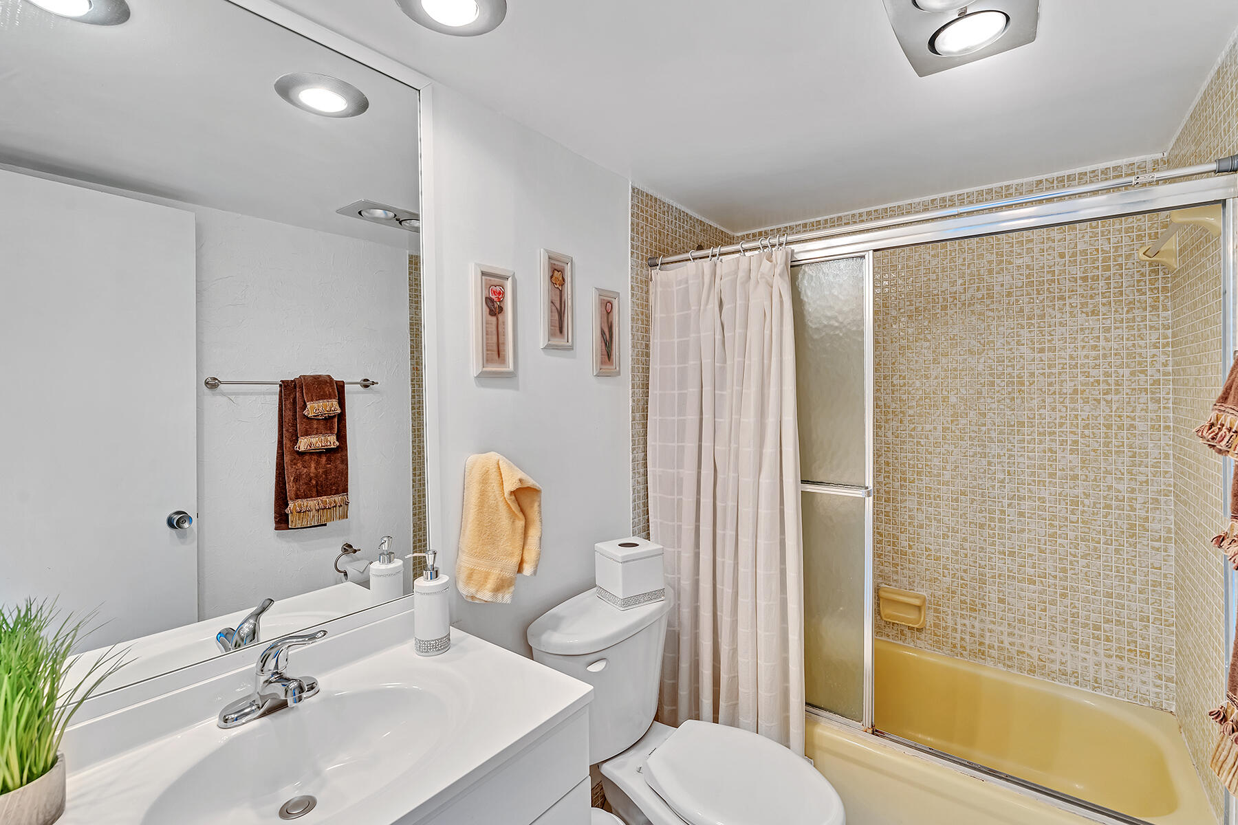 3091 North Course Drive, Unit 108 Pompano Beach, FL 33069 - Photo 29 of 42 a bathroom with a sink toilet and shower