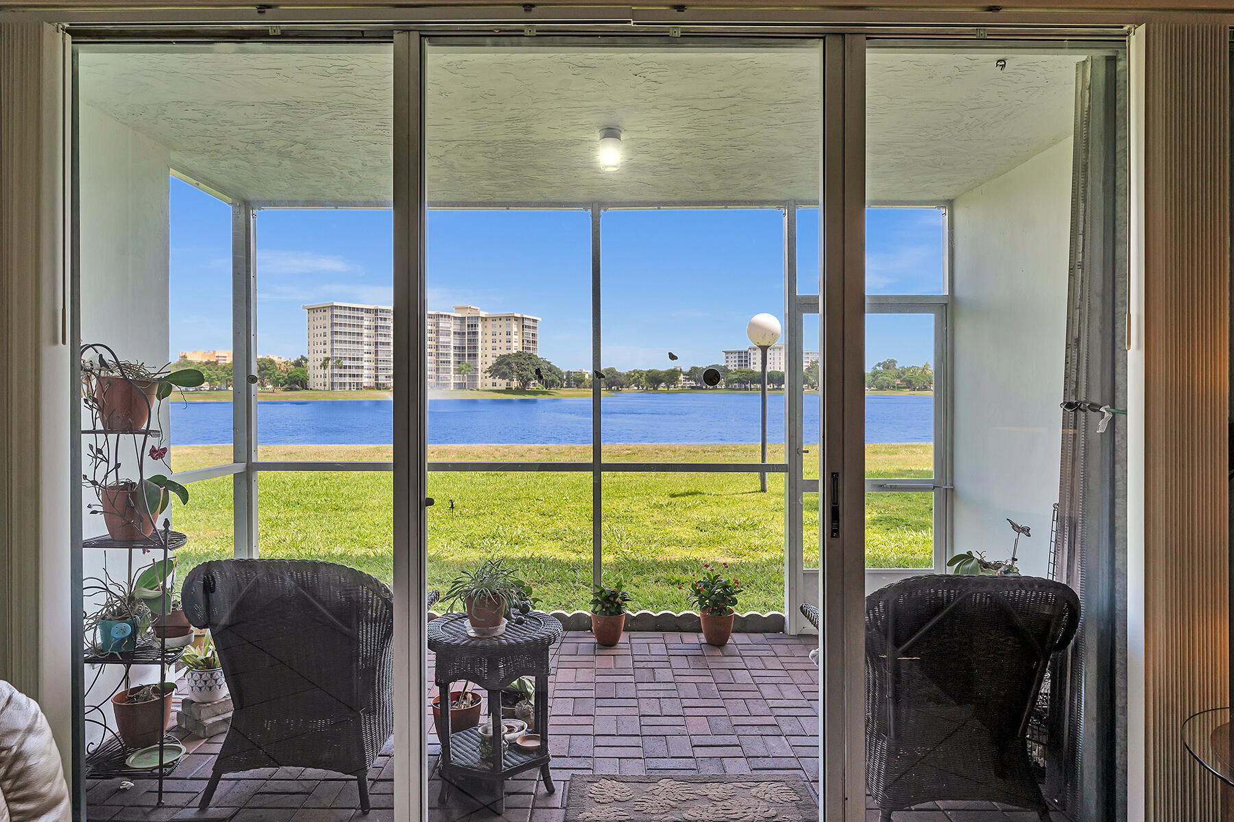 3091 North Course Drive, Unit 108 Pompano Beach, FL 33069 - Photo 31 of 42 a view of an outdoor space with seating area