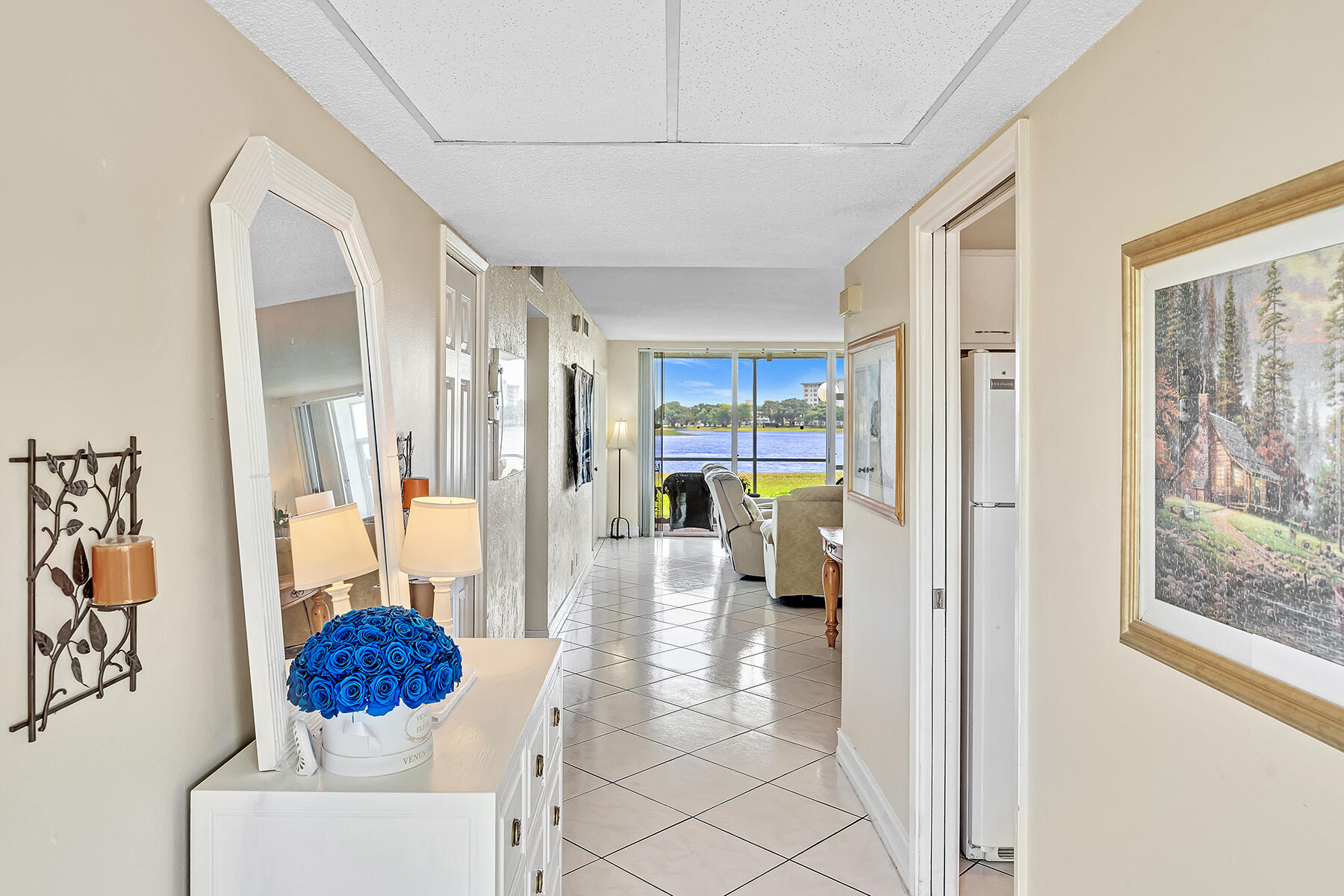 3091 North Course Drive, Unit 108 Pompano Beach, FL 33069 - Photo 5 of 42 a living room with furniture and a floor to ceiling window
