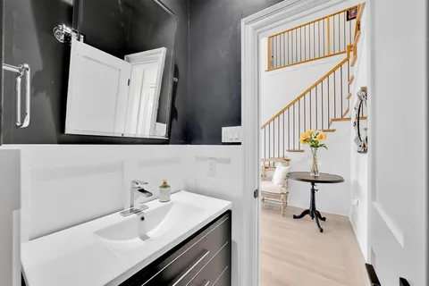 a bathroom with a sink and a mirror