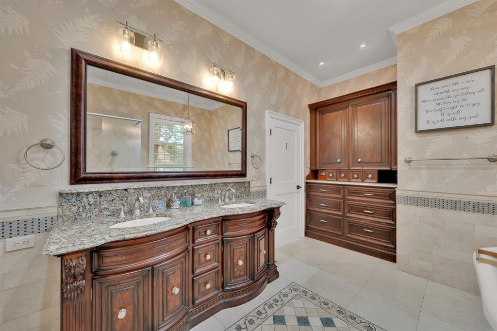 1431 Travis Circle North Irving, TX 75038 - Photo 26 of 40 a bathroom with a sink a vanity and a large mirror