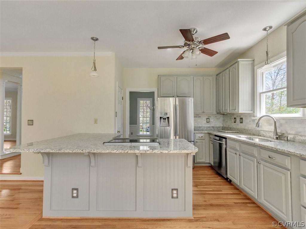 6000 Sedgefield Road Midlothian, VA 23112 - Photo 17 of 36 a large kitchen with stainless steel appliances granite countertop a sink a stove a refrigerator and island with wooden floor