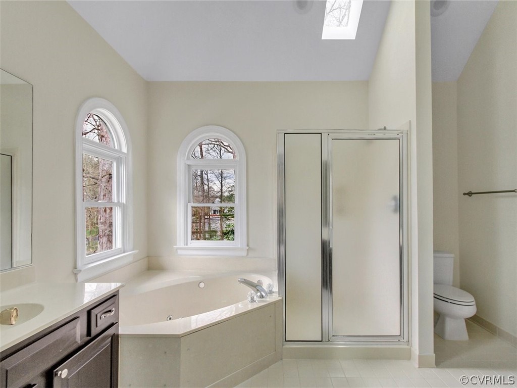 6000 Sedgefield Road Midlothian, VA 23112 - Photo 25 of 36 a bathroom with a tub a toilet and a window
