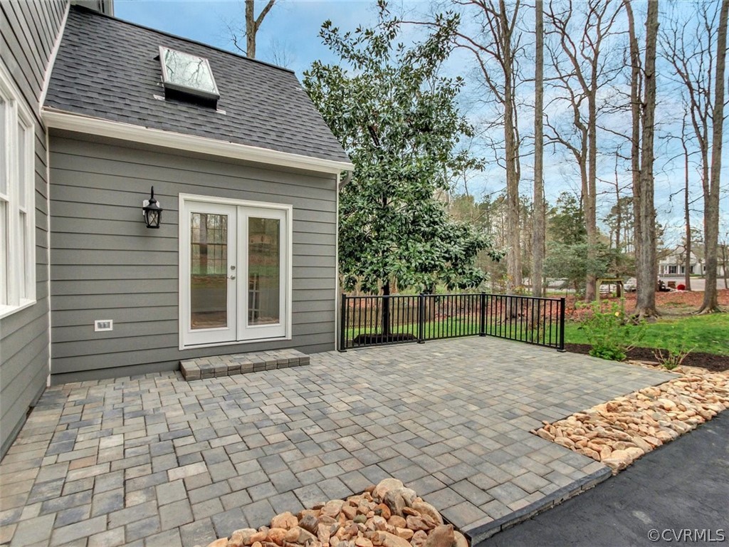 6000 Sedgefield Road Midlothian, VA 23112 - Photo 34 of 36 a view of a brick house with a large window and wooden fence