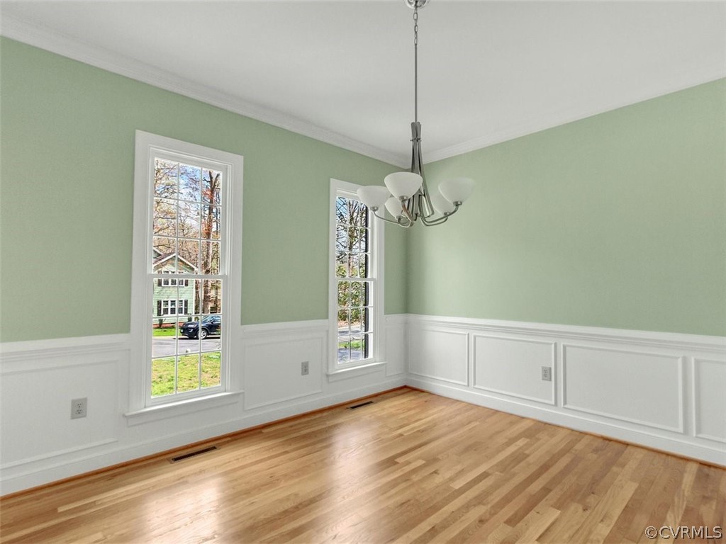 6000 Sedgefield Road Midlothian, VA 23112 - Photo 5 of 36 a view of an empty room with window and wooden floor