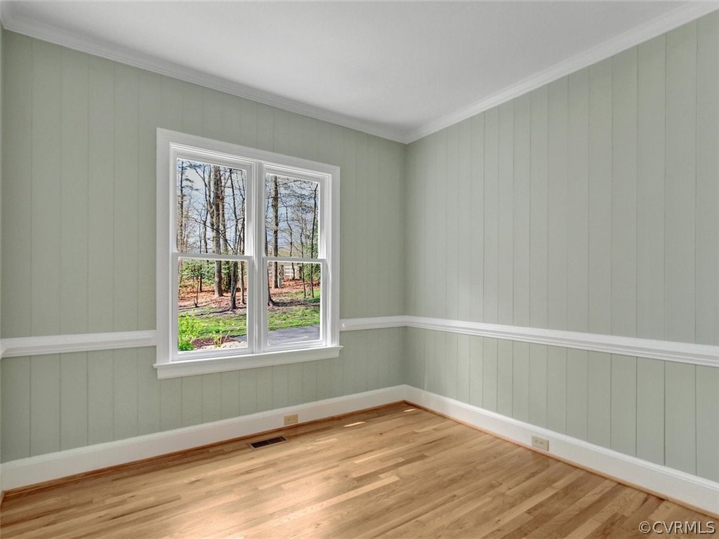 6000 Sedgefield Road Midlothian, VA 23112 - Photo 10 of 36 a view of an empty room with wooden floor and a window