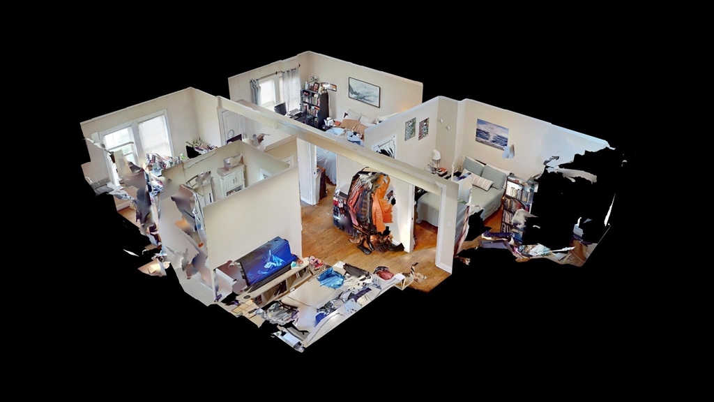 2973 Washington Street, Unit 2 Boston, MA 02119 - Photo 6 of 6 a white bed sitting in a living room