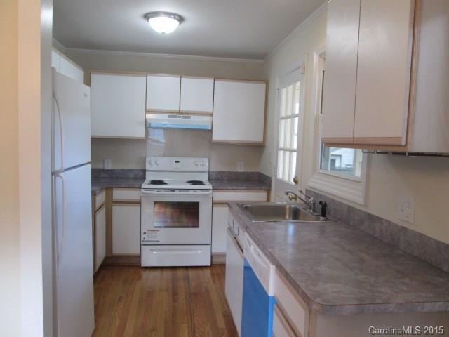 1458 Cortland Road West Charlotte, NC 28209 - Photo 4 of 9 a kitchen with granite countertop a sink stainless steel appliances and cabinets