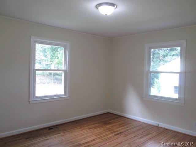 1458 Cortland Road West Charlotte, NC 28209 - Photo 5 of 9 a view of a room with wooden floor and windows in it