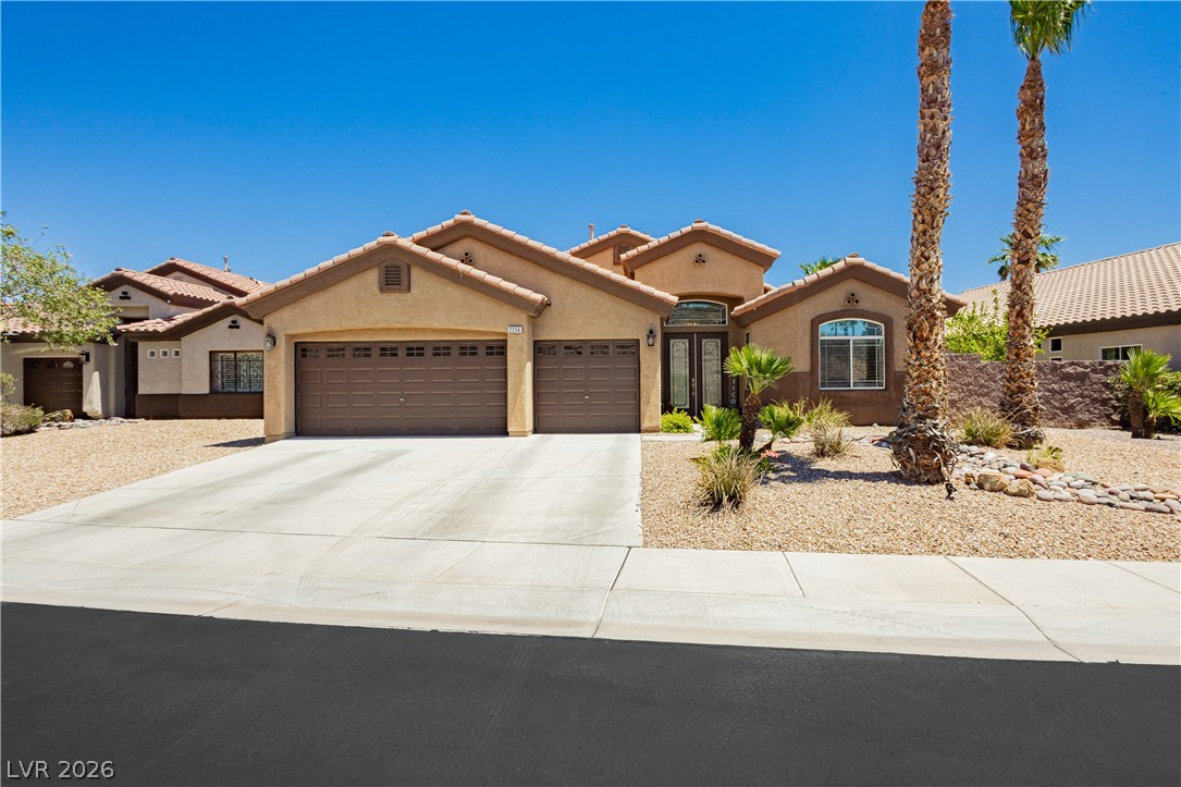 2256 Dogwood Ranch Avenue Henderson, NV 89052 - Photo 1 of 51 A well-maintained stucco facade with a concrete driveway welcomes you to this desert oasis.