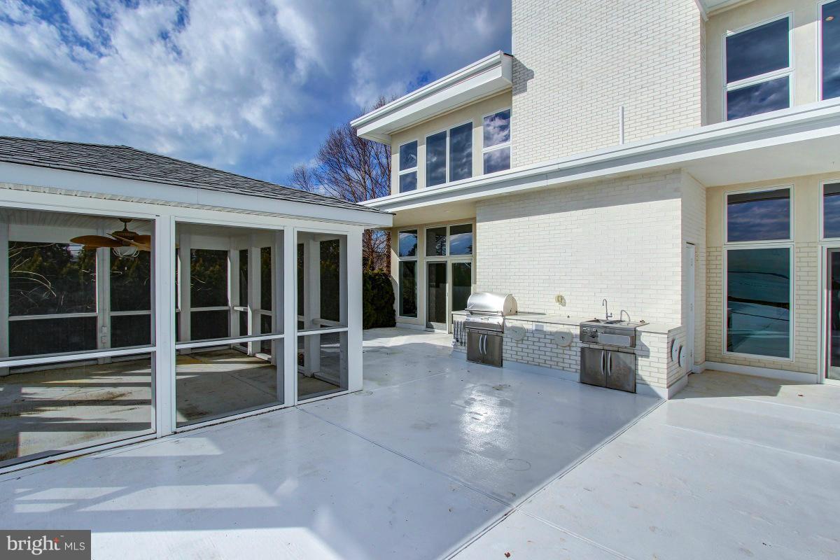 2927 Cox Neck Road East Chester, MD 21619 - Photo 12 of 30 Outdoor kitchen and screened gazebo