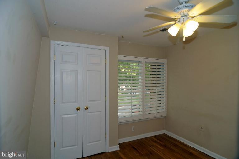 7946 Inverness Ridge Road Potomac, MD 20854 - Photo 12 of 25 a view of a livingroom with a chandelier fan and a window