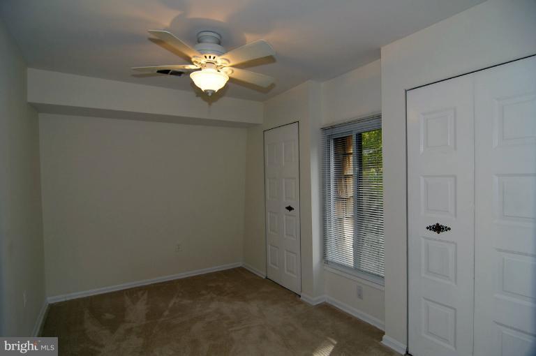 7946 Inverness Ridge Road Potomac, MD 20854 - Photo 13 of 25 a view of a livingroom with a chandelier fan