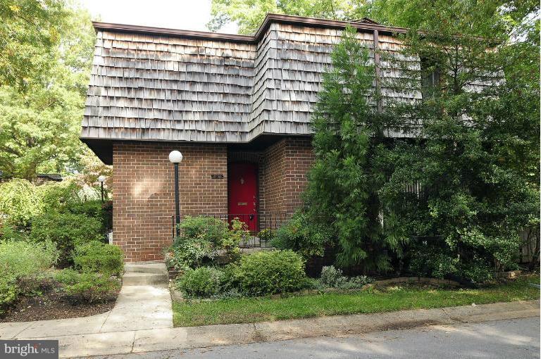 7946 Inverness Ridge Road Potomac, MD 20854 - Photo 14 of 25 a view of a brick house with plants