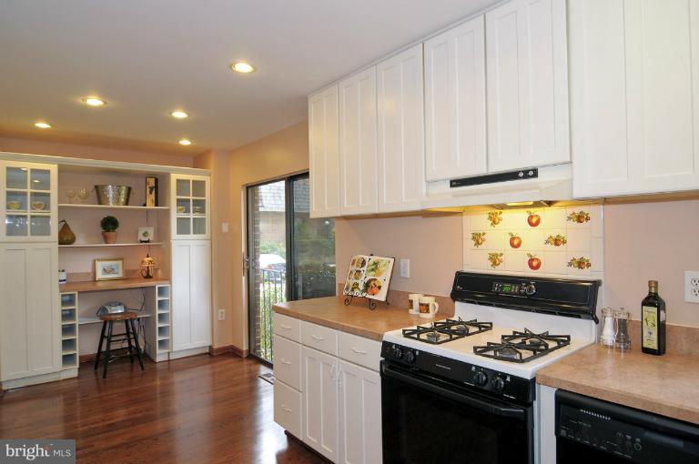 7946 Inverness Ridge Road Potomac, MD 20854 - Photo 17 of 25 a kitchen with stainless steel appliances granite countertop a stove and a cabinets