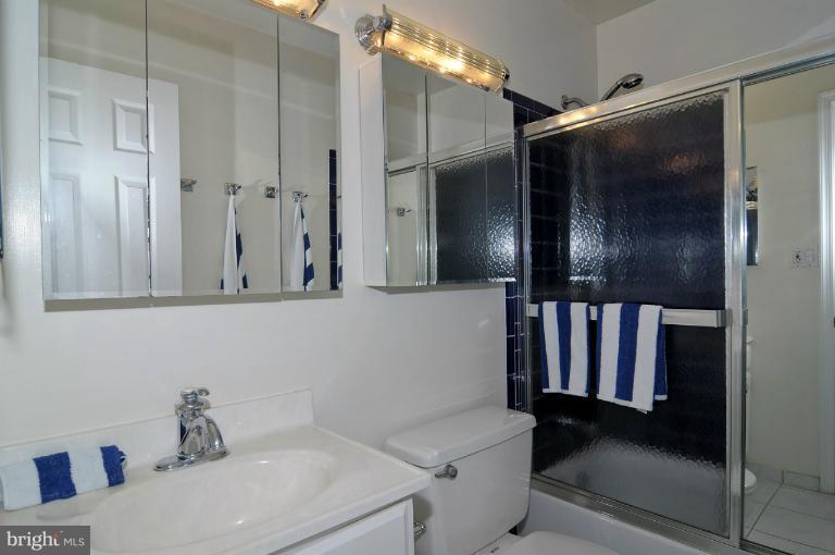 7946 Inverness Ridge Road Potomac, MD 20854 - Photo 24 of 25 a bathroom with a sink and a mirror