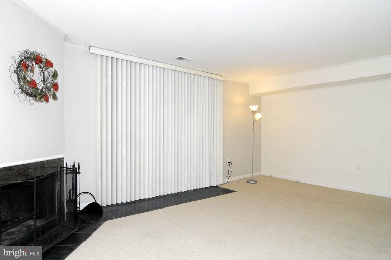 7946 Inverness Ridge Road Potomac, MD 20854 - Photo 8 of 25 a view of a room with wooden floor and a window