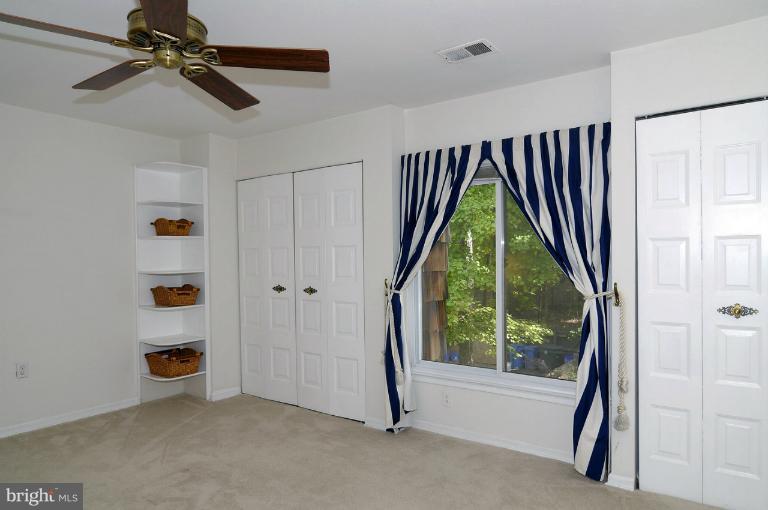 7946 Inverness Ridge Road Potomac, MD 20854 - Photo 10 of 25 a view of room with a window and a ceiling fan