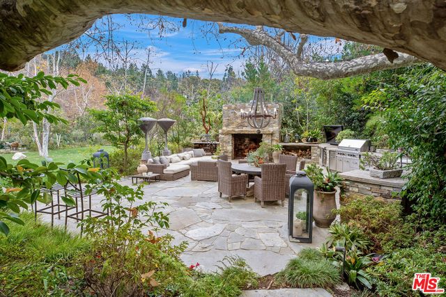 a patio with table and chairs