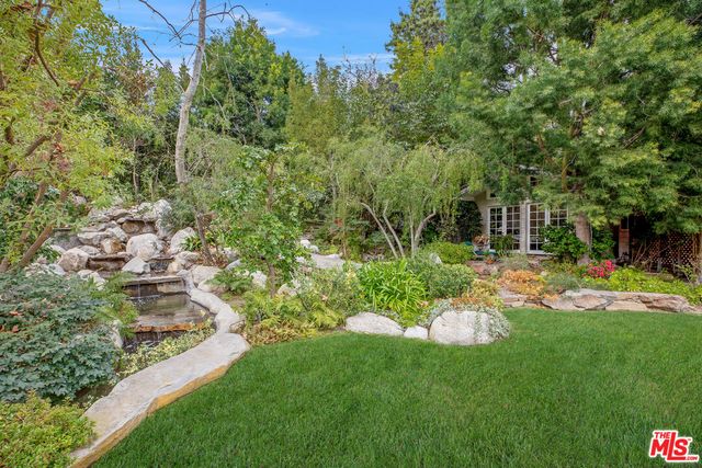 a view of a garden with a fountain