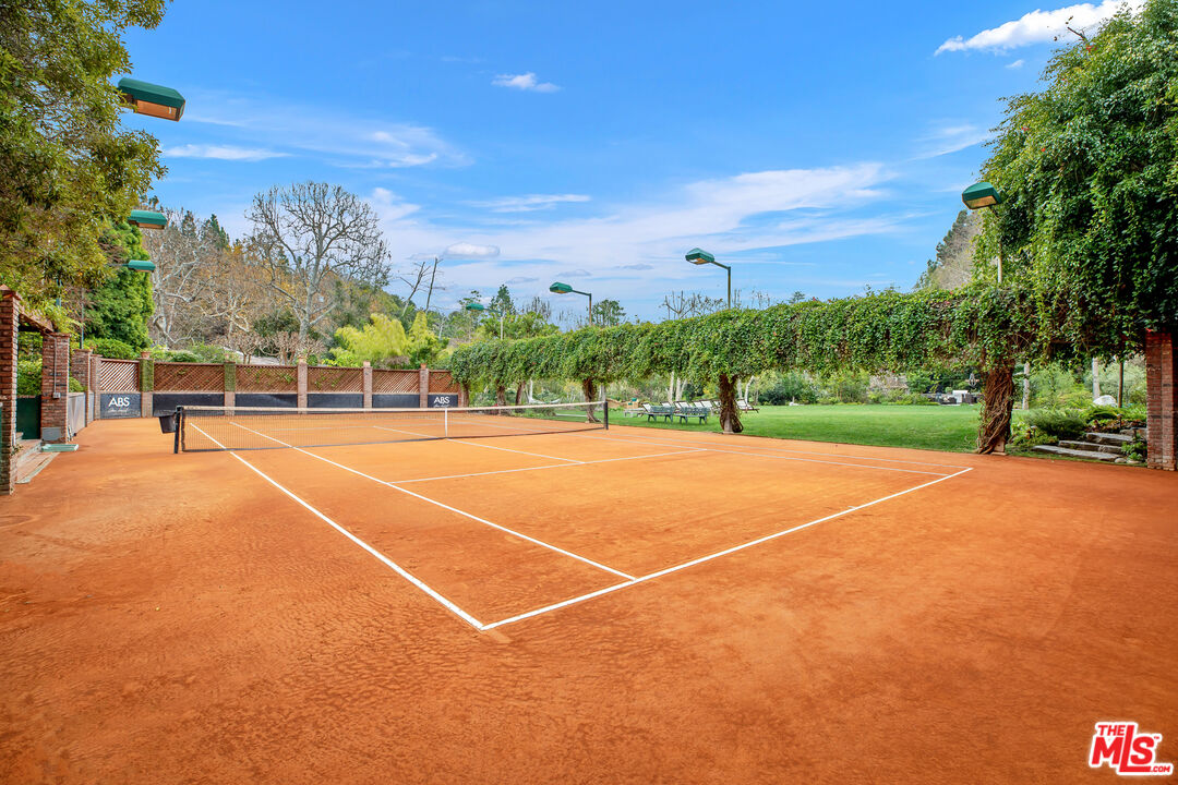 2383 Mandeville Canyon Road Los Angeles, CA 90049 - Photo 21 of 51 a view of a tennis court