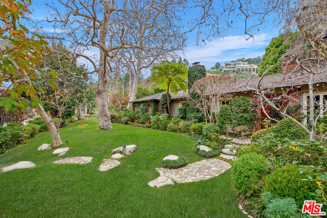 2383 Mandeville Canyon Road Los Angeles, CA 90049 - Photo 22 of 51 a garden view with plants