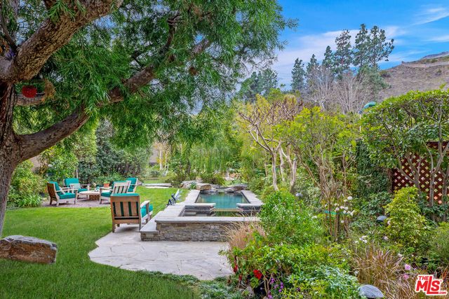 a view of a garden with a fountain