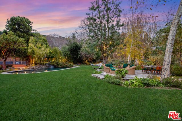 a view of a park with large trees
