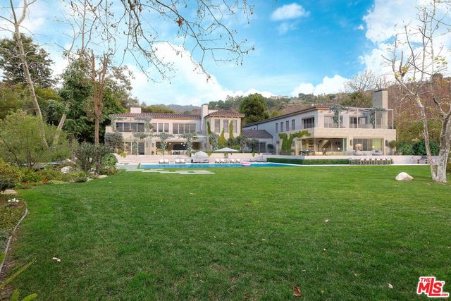 a view of a building with a yard