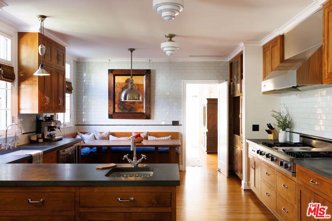 4207 Dundee Drive Los Angeles, CA 90027 - Photo 12 of 33 a kitchen with stainless steel appliances granite countertop a sink stove and refrigerator