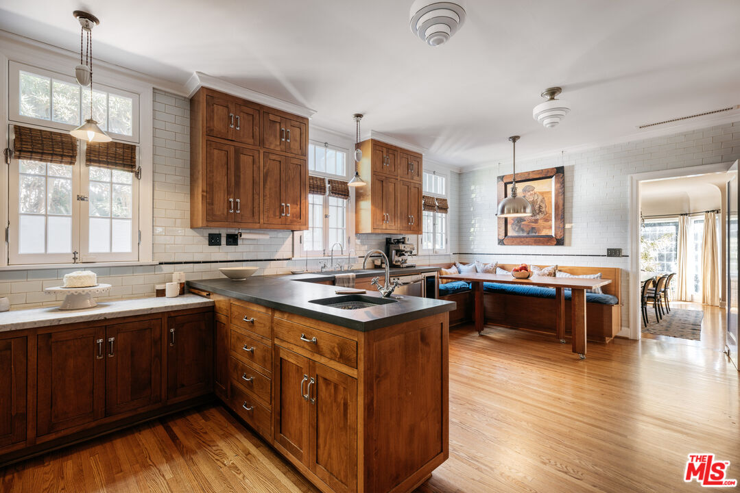 4207 Dundee Drive Los Angeles, CA 90027 - Photo 13 of 33 a kitchen with a stove sink and cabinets