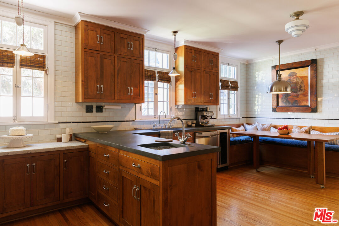 4207 Dundee Drive Los Angeles, CA 90027 - Photo 14 of 33 a kitchen with a sink stove and cabinets