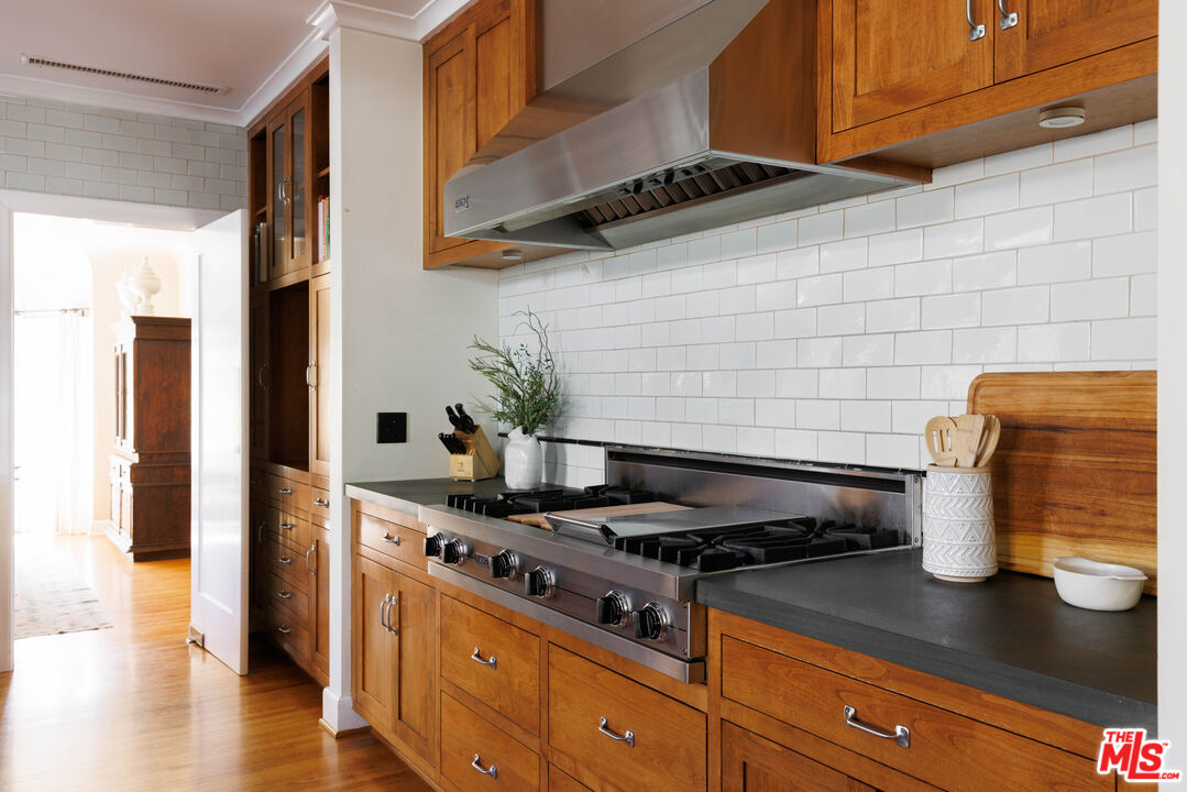 4207 Dundee Drive Los Angeles, CA 90027 - Photo 15 of 33 a kitchen with a stove and a potted plant