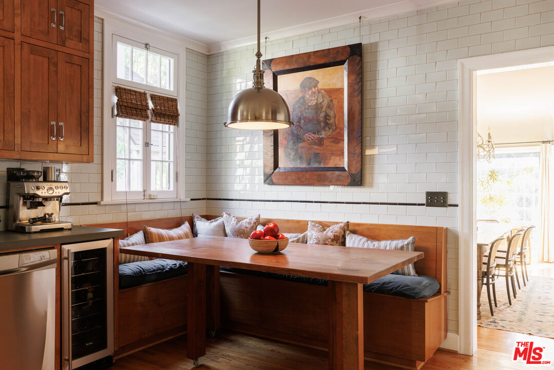 4207 Dundee Drive Los Angeles, CA 90027 - Photo 16 of 33 a view of a kitchen with a sink a window and dining table