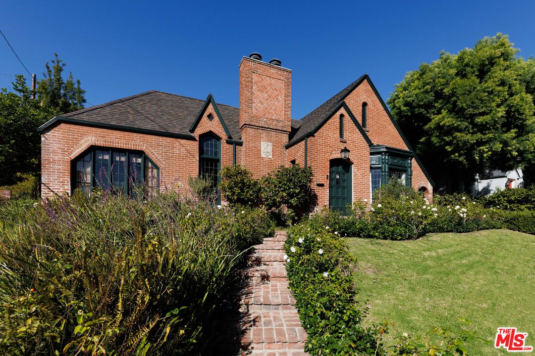4207 Dundee Drive Los Angeles, CA 90027 - Photo 2 of 33 a front view of a house with a yard