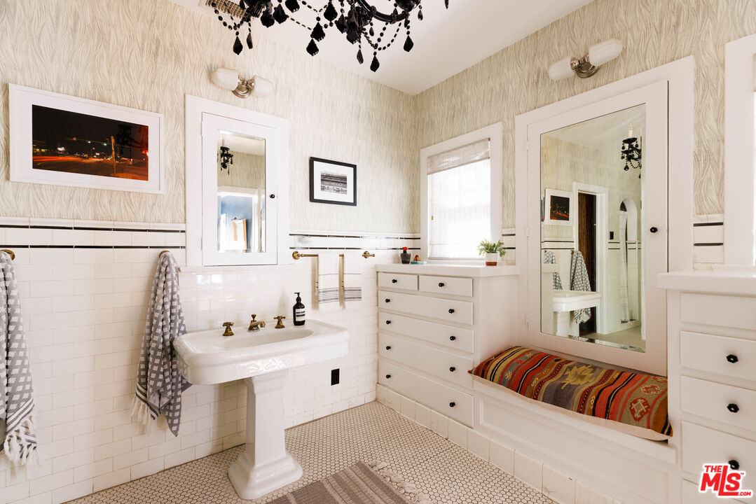 4207 Dundee Drive Los Angeles, CA 90027 - Photo 22 of 33 a living room with furniture and a flat screen tv