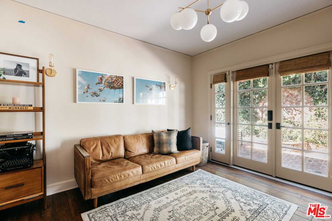 4207 Dundee Drive Los Angeles, CA 90027 - Photo 29 of 33 a living room with furniture and a large window