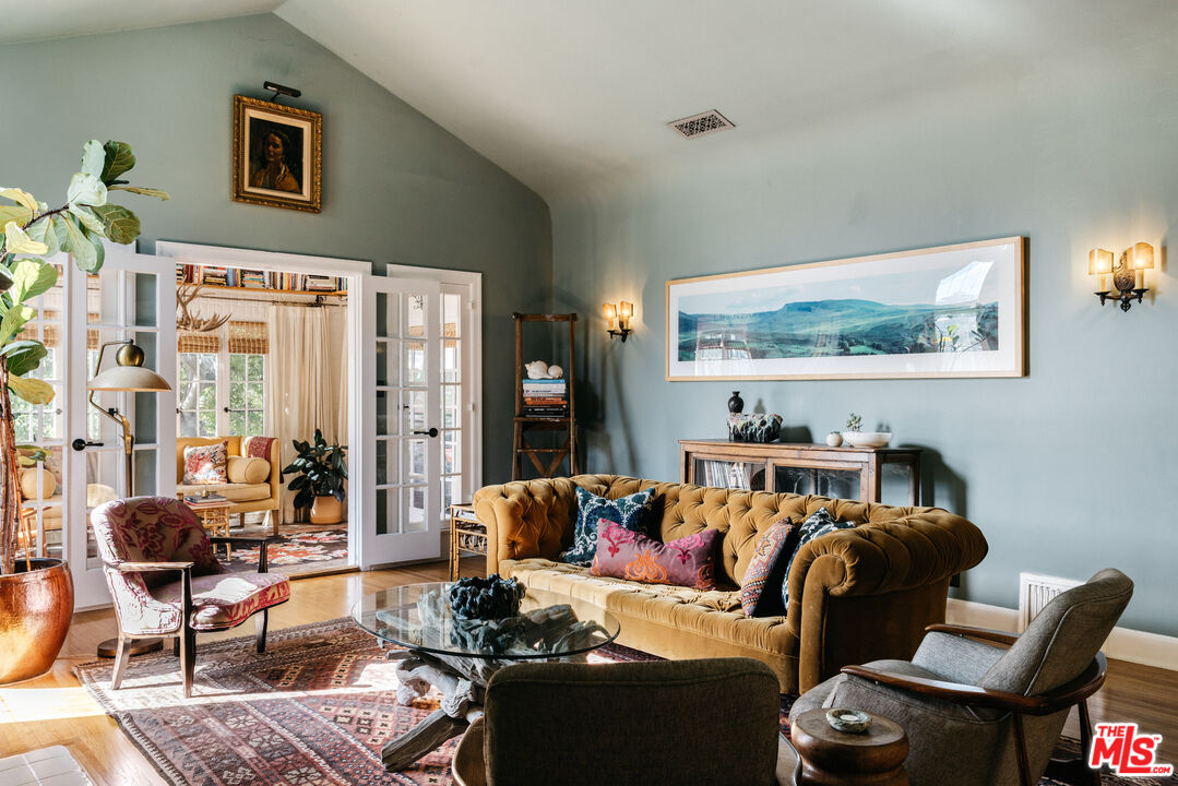 4207 Dundee Drive Los Angeles, CA 90027 - Photo 3 of 33 a living room with furniture and a large window