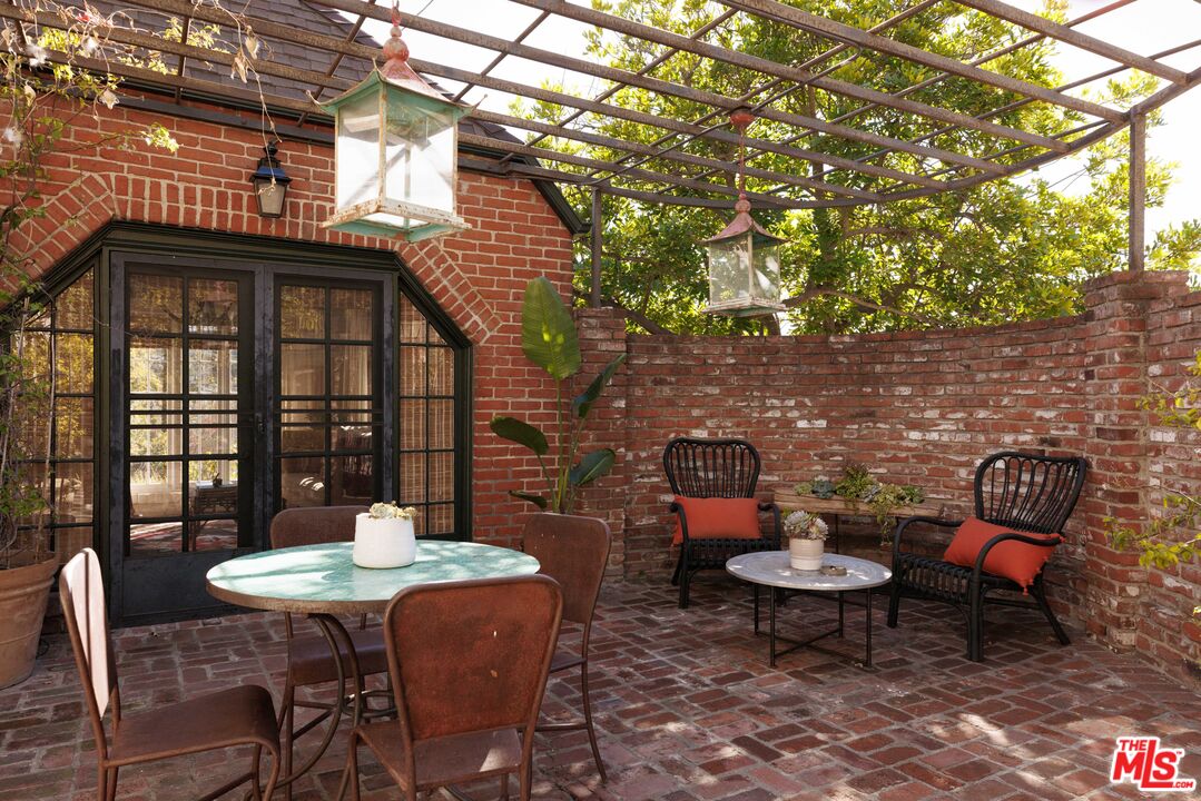 4207 Dundee Drive Los Angeles, CA 90027 - Photo 32 of 33 a backyard of a house with table and chairs