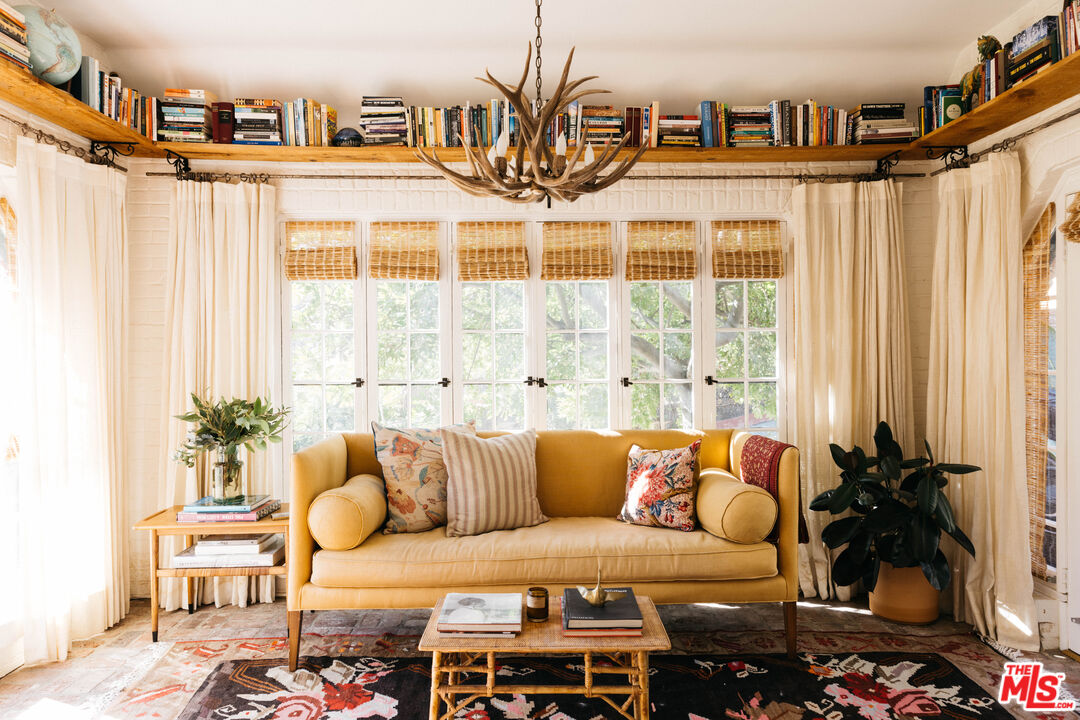 4207 Dundee Drive Los Angeles, CA 90027 - Photo 5 of 33 a living room with furniture and a large window