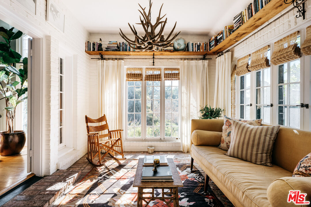 4207 Dundee Drive Los Angeles, CA 90027 - Photo 6 of 33 a living room with furniture and a large window