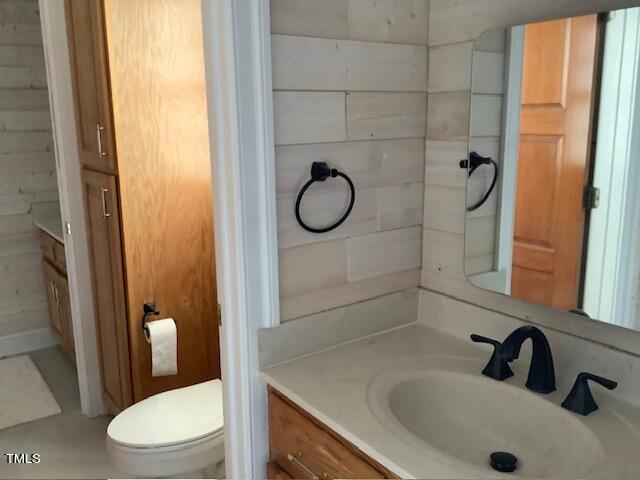 2125 Keith Hills Road Lillington, NC 27546 - Photo 45 of 66 a bathroom with a granite countertop sink toilet and shower