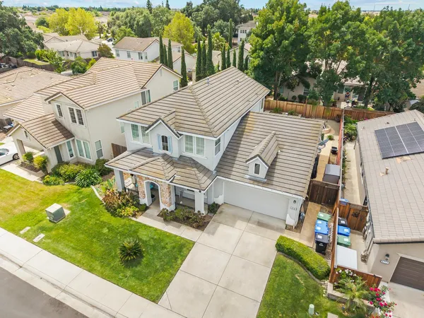 an aerial view of a house with a garden