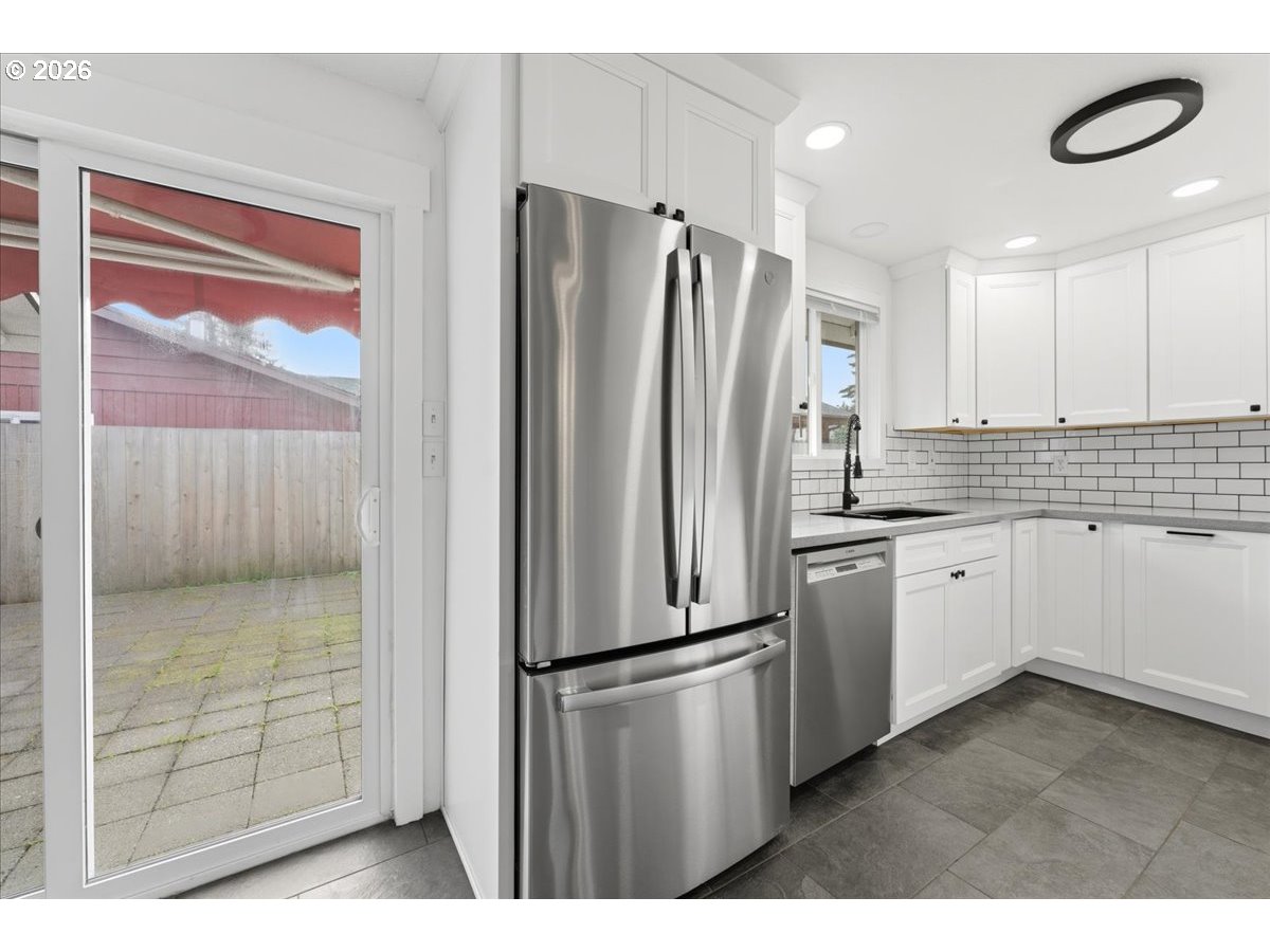 369 South 16th Avenue Cornelius, OR 97113 - Photo 25 of 29 a kitchen with a refrigerator a sink and cabinets